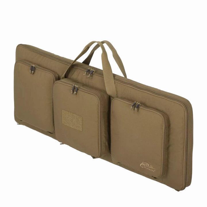 Brown gun case with multiple compartments on a white background