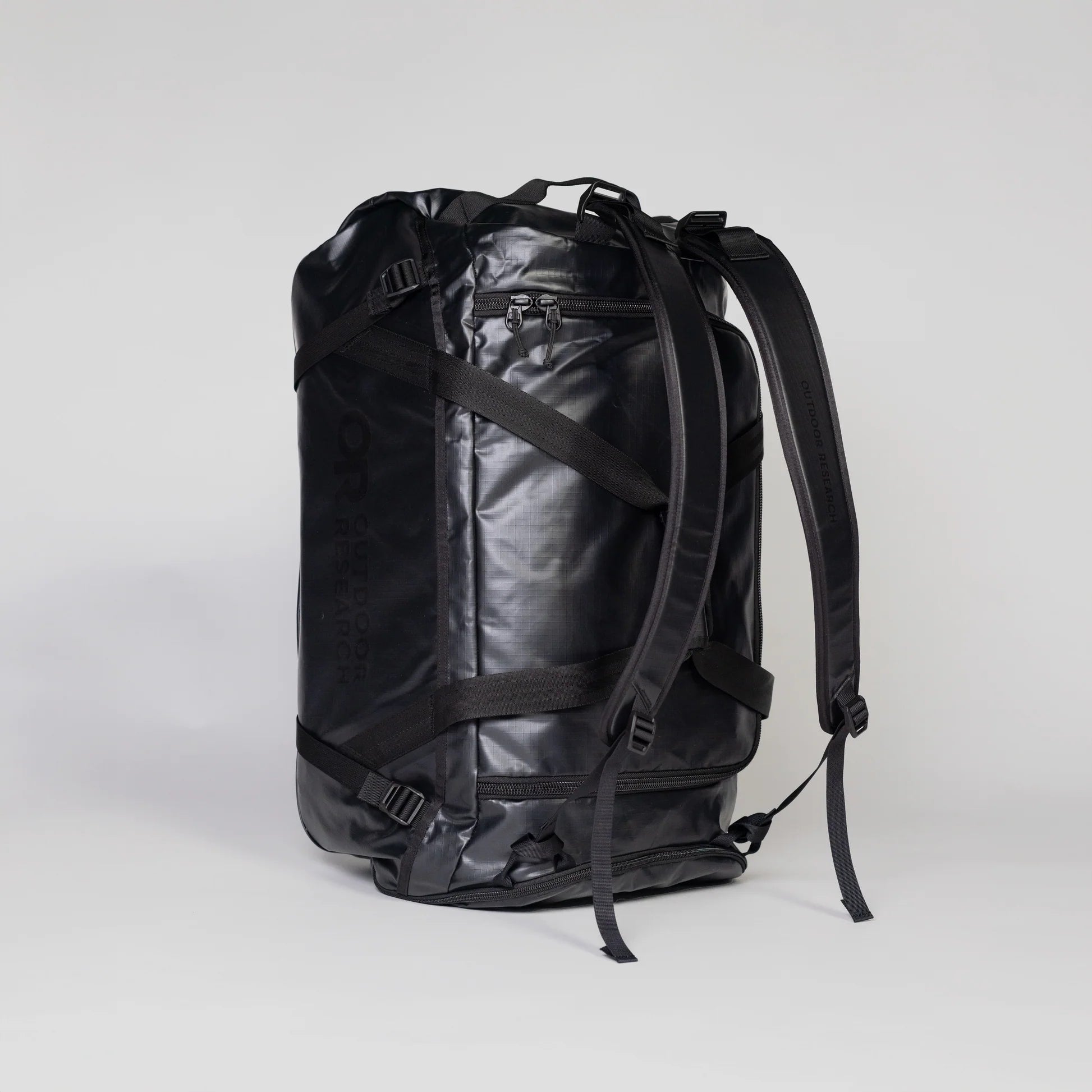 Black backpack on a light gray background