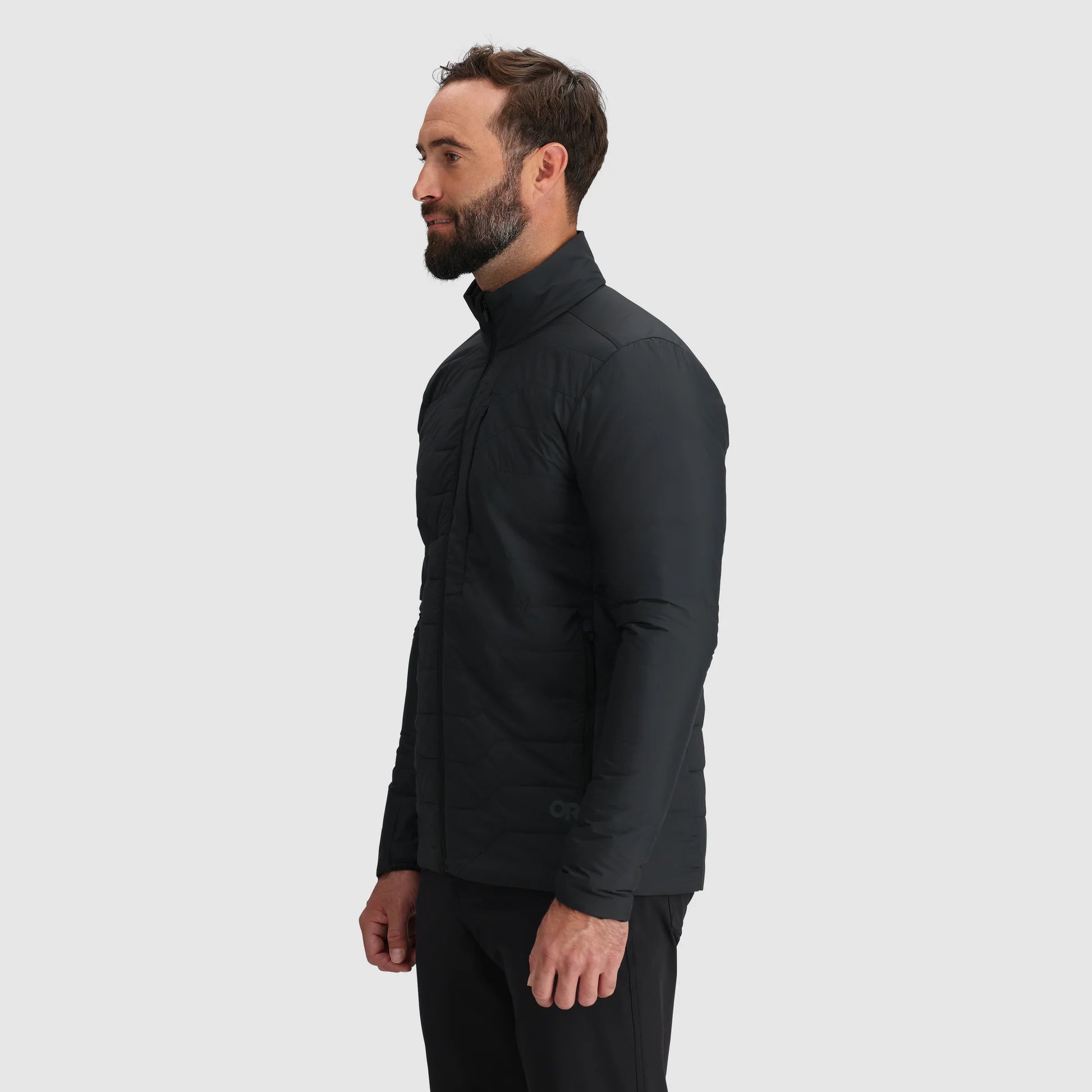 Man wearing a black shirt and pants on a white background