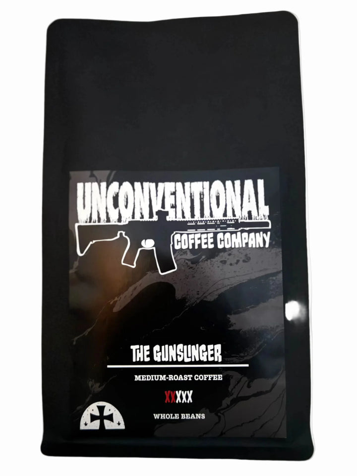 Black coffee bag with 'Unconventional Coffee Company' branding on a white background