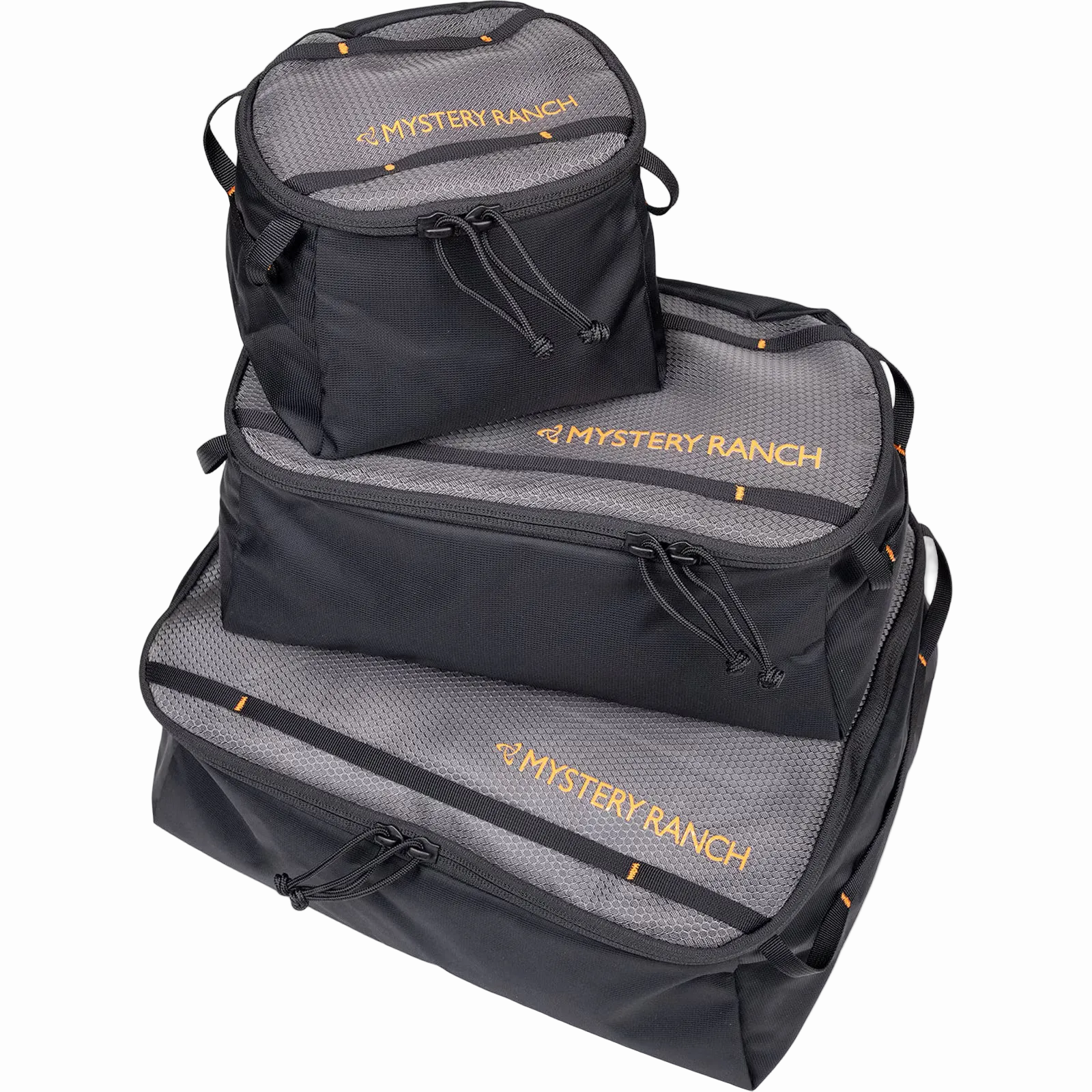 Set of three black and gray bags with 'Mystery Ranch' branding on a white background