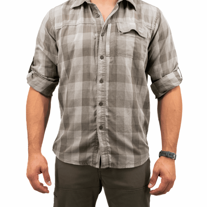 Person wearing a gray plaid shirt on a white background